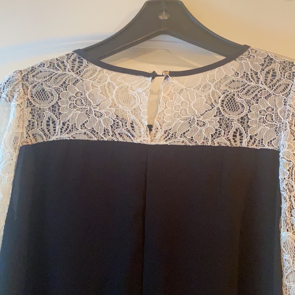 Black dress. White lace long sleeve. Fits like a size small/medium.